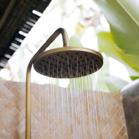 Antique brass showers in handcrafted recycled teak villas Villa Jati Sumbawa